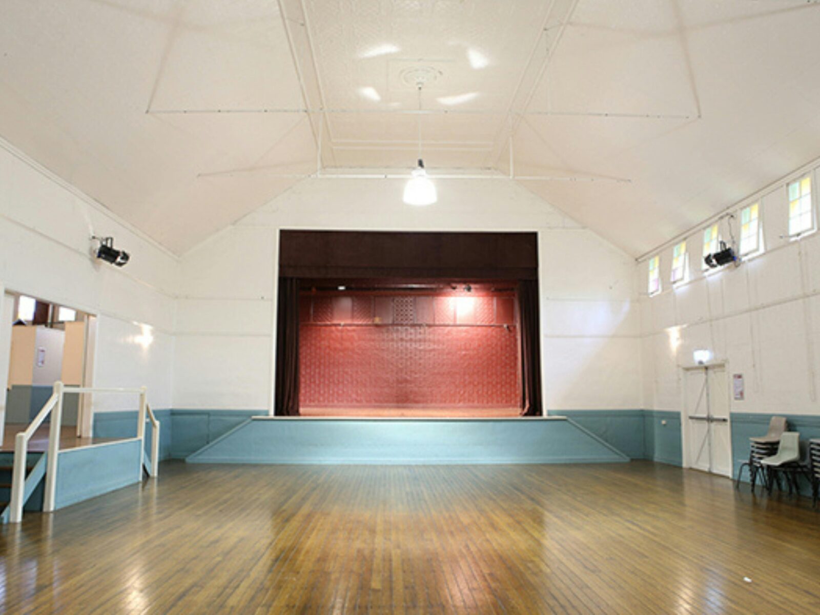 image of empty hall with text over that says NORTHERN RIVERS RHYTHM FESTIVAL
