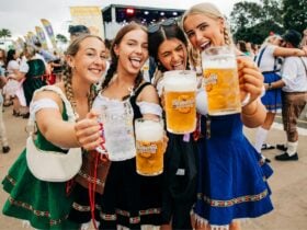 Girls holding beer glasses