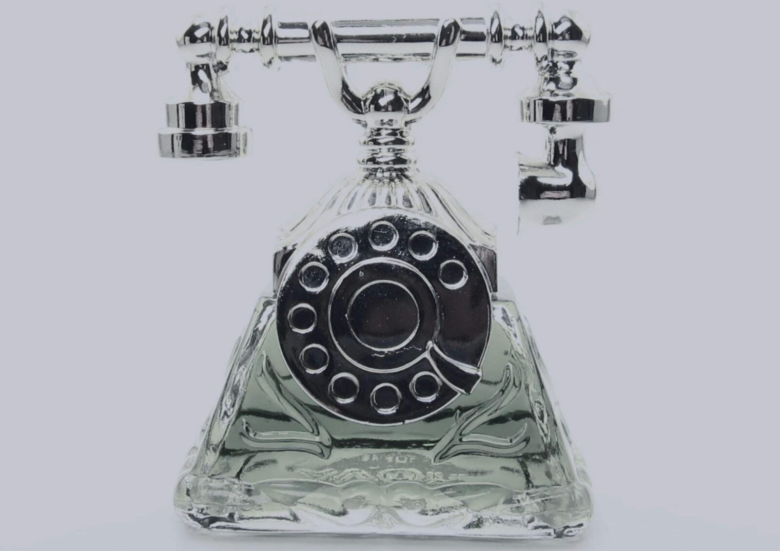 a perfume bottle shaped like a telephone