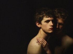 Dark Artistic picture of two young men.