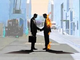 Two man shaking hands, one on fire