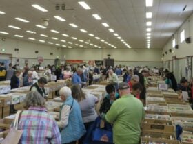 Depicts a view of the Hall at a Book Fair,