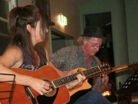 Rous Unplugged at Rous Mill Hall people playing guitar