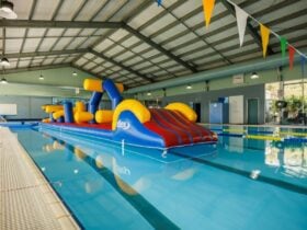 Inflatable obstacle course in pool at Sussex Inlet Aquatic Centre