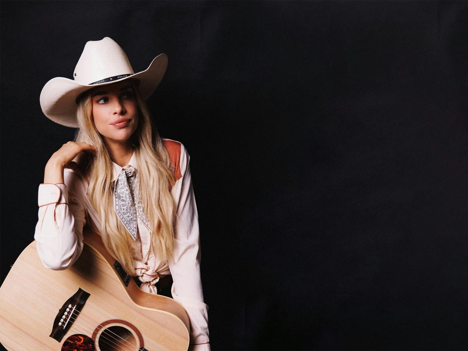Saralyn Cowper posed with guitar