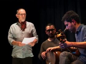 Artists standing together holding their instruments