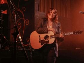 The Maes bang member playing guitar