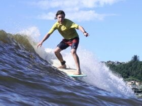 Longboarder surfing wave