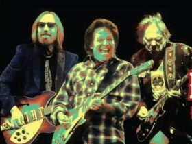 three man paying musical instruments in a rock band