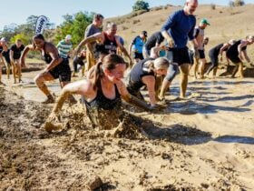 Racer running through a mud flat