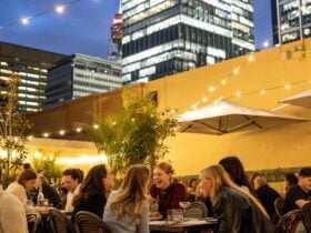 People enjoying trivia at a rooftop bar