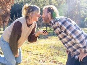 Couple smelling truffles they have found - about to kiss over the truffle