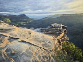 A painting of the blue mountains