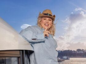 Urzila Carlson posing for a photo on a yacht.