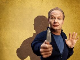 Scared looking man holding a knife