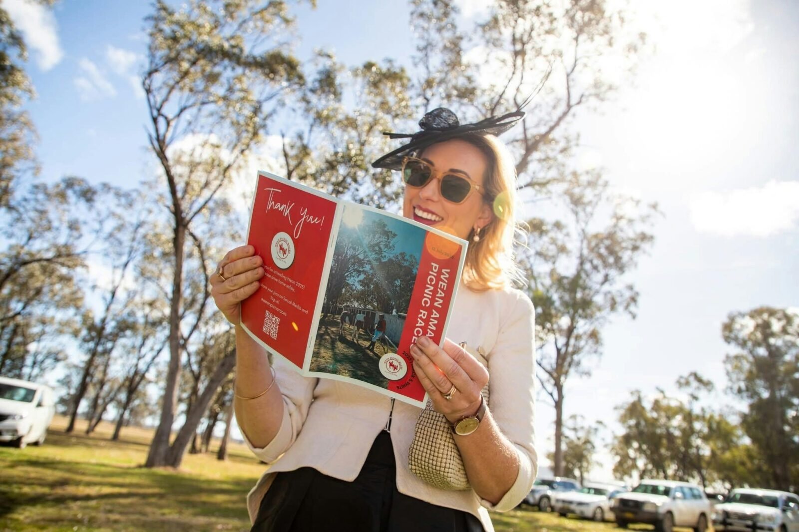 Racegoer reading the racebook from 2025 races