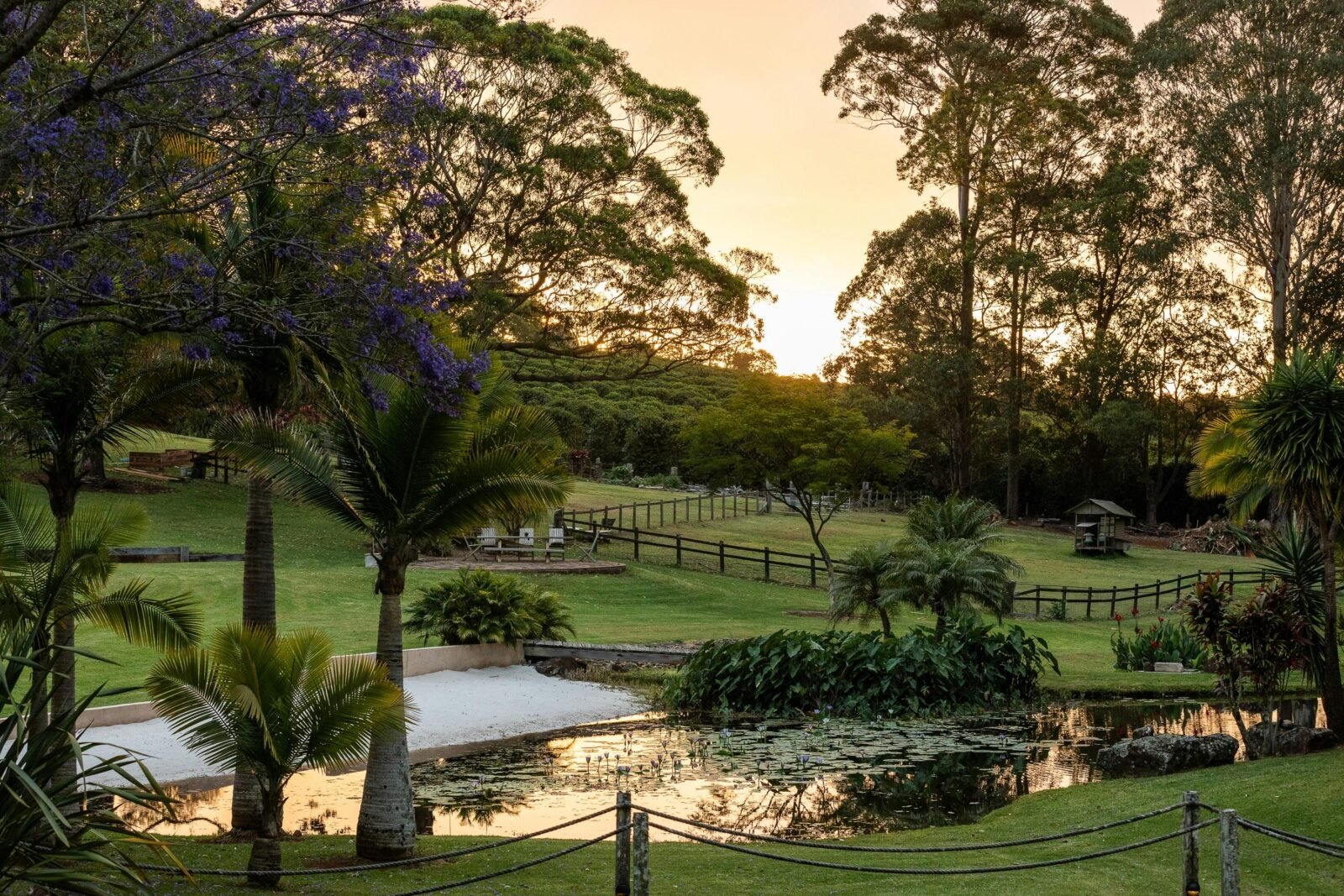 View of sun setting over land