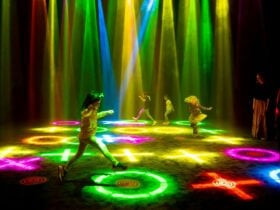 Children run across a light filled room