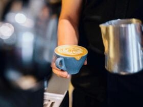 Barista making morning coffees at Artificer Cafe