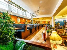Retro style booths and lighting surrounded by retro homewares and vintage decor