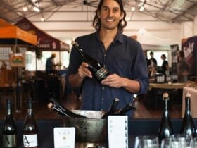 Aurum Mead creator holding wines at hall pop up