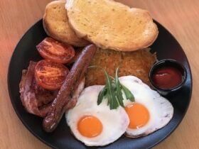Bacon, sausage, eggs, grilled tomatoes, hash browns and toast