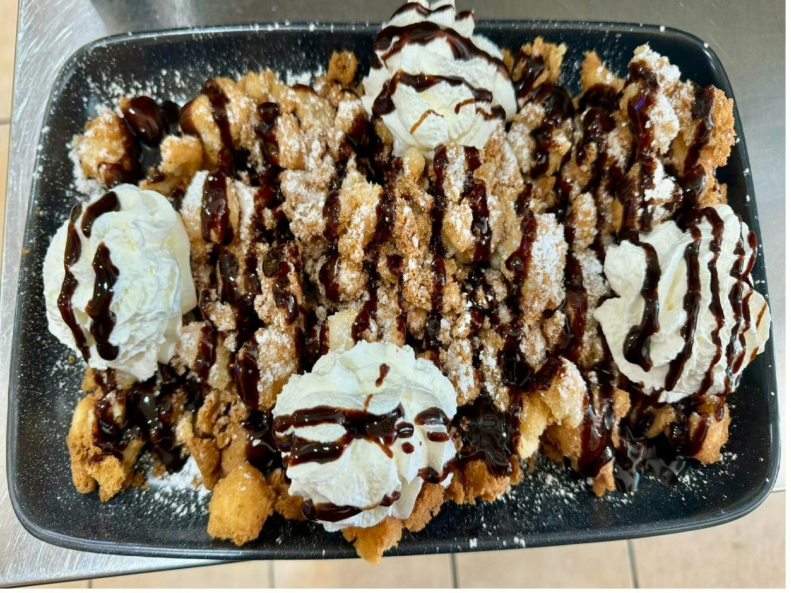 Funnel Cake with cream and chocolate sauce