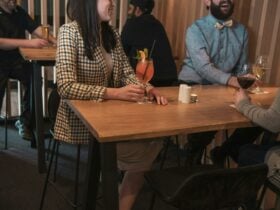 Guests enjoying cocktails at high tables