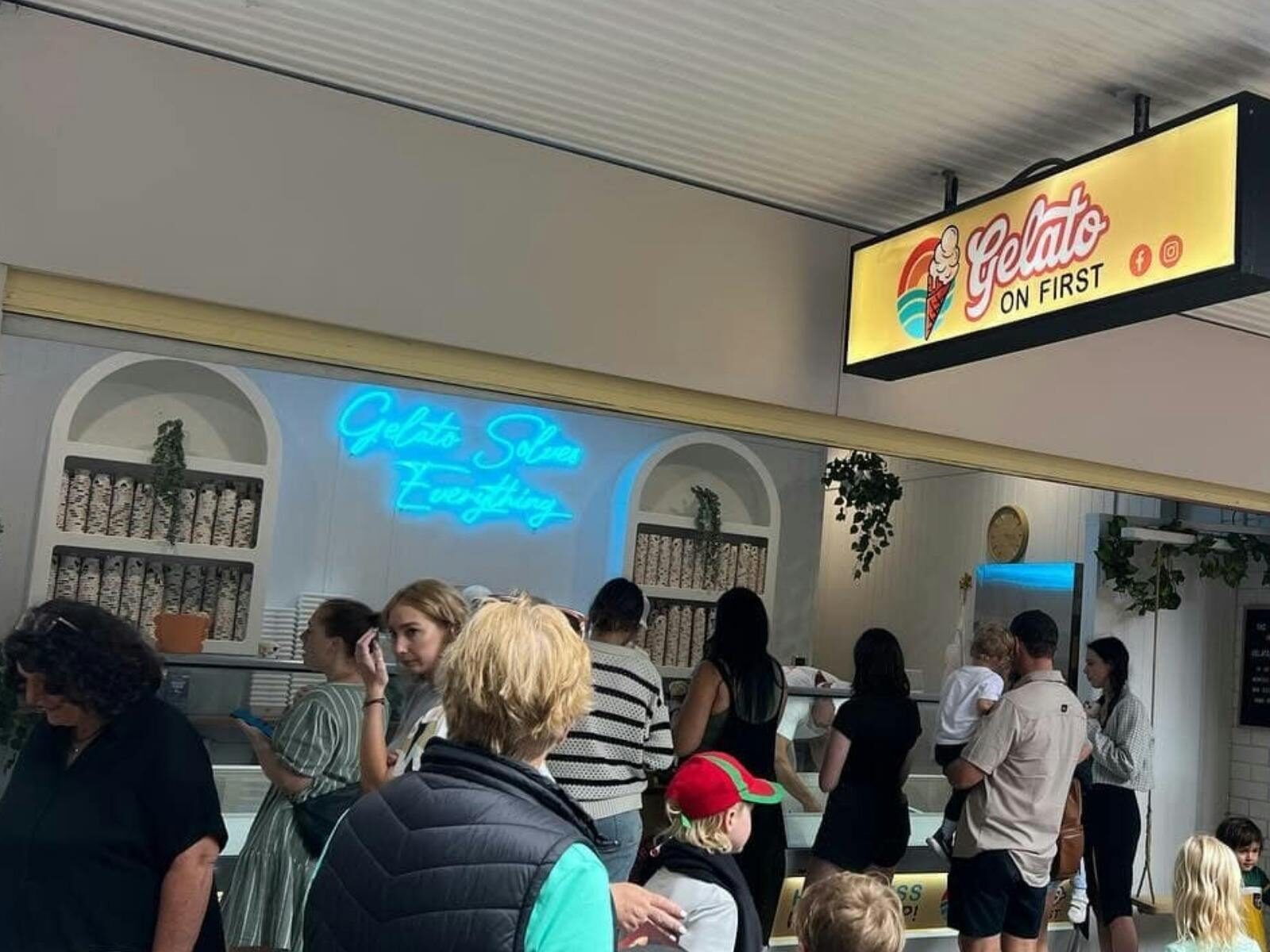 Shop front with people lining up for gelato