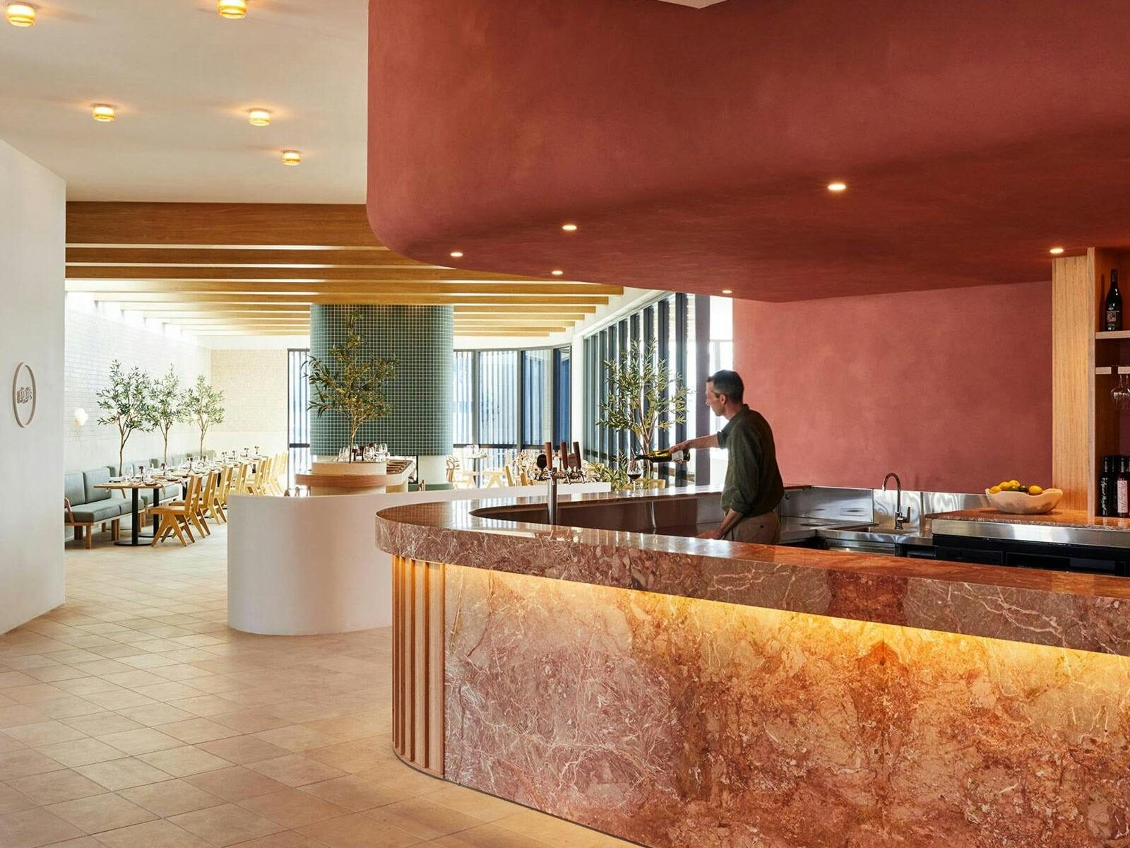 Beautiful Marble Bar with bartender preparing a drink