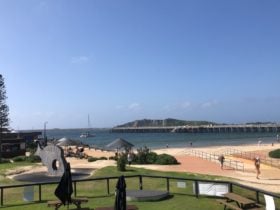 Picture of the lawn, beach and the Jetty at Coffs Harbour