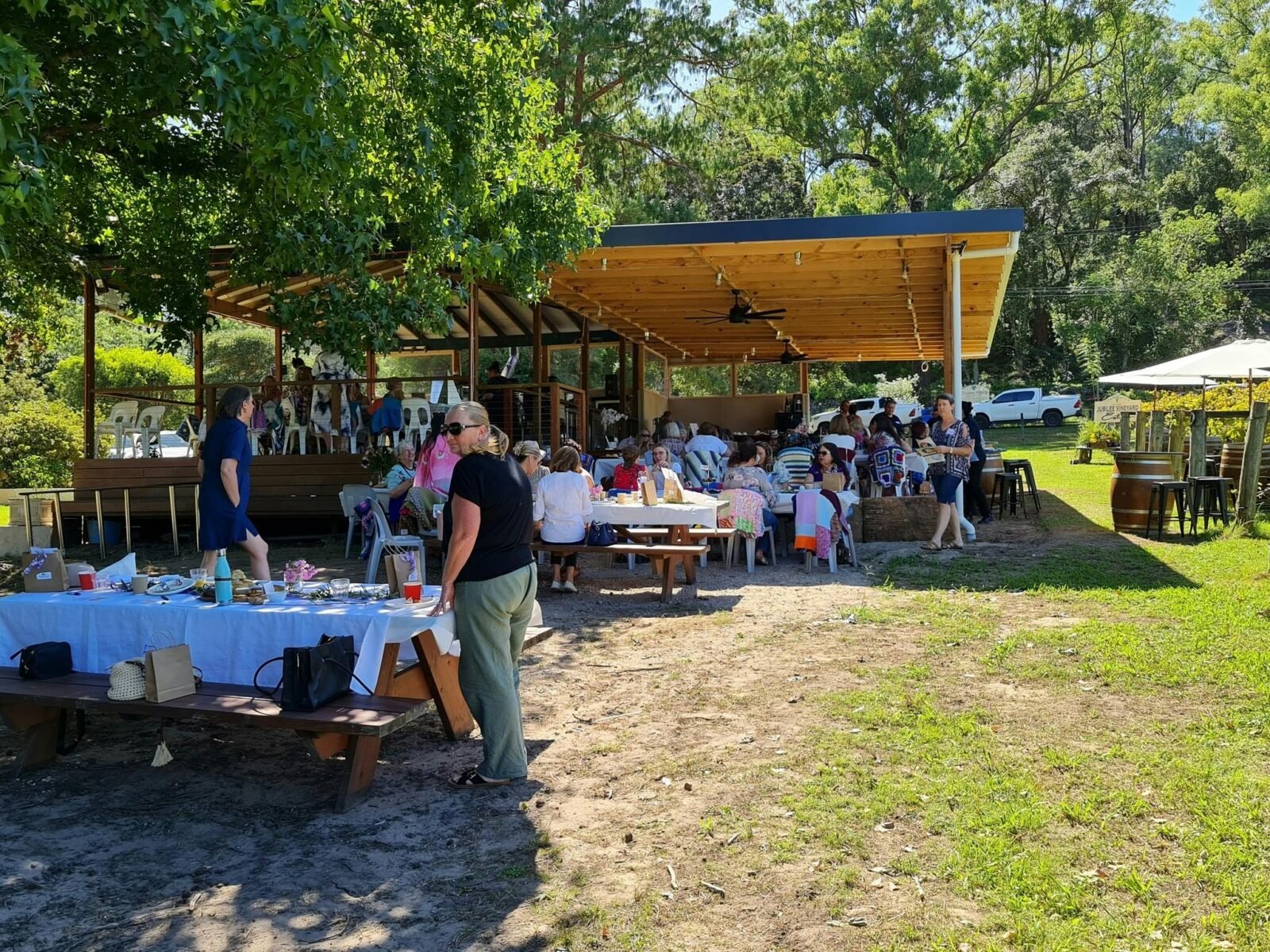 Large number of people sitting in the sun enjoying an afternoon on the Jubilee Deck