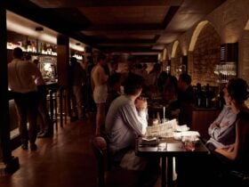 Interior of Letra House, showing part of the venue's seating - along the banquettes and bar.