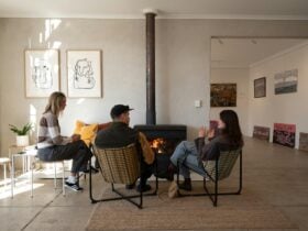 Friends sipping by the fire