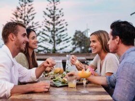 Friends enjoying food and drink at Mumbo Jumbo’s Beachhouse, Terrigal