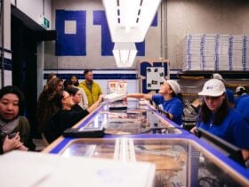 Customers ordering pizza inside the store