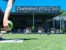 Photo of Ourimbah RSL exterior signage, taken over the bowling green