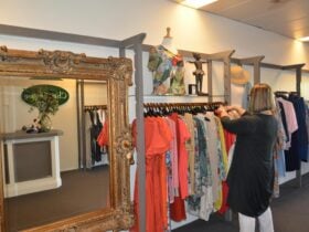 inside store with clothing racks and mirror