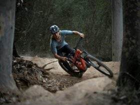 lone mountain biker cornering in berm
