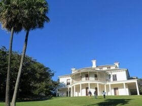 People walking up the lawn to Strickland House, Sydney Harbour National Park. Photo: Elinor