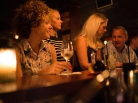 Enjoying a drink at a small bar