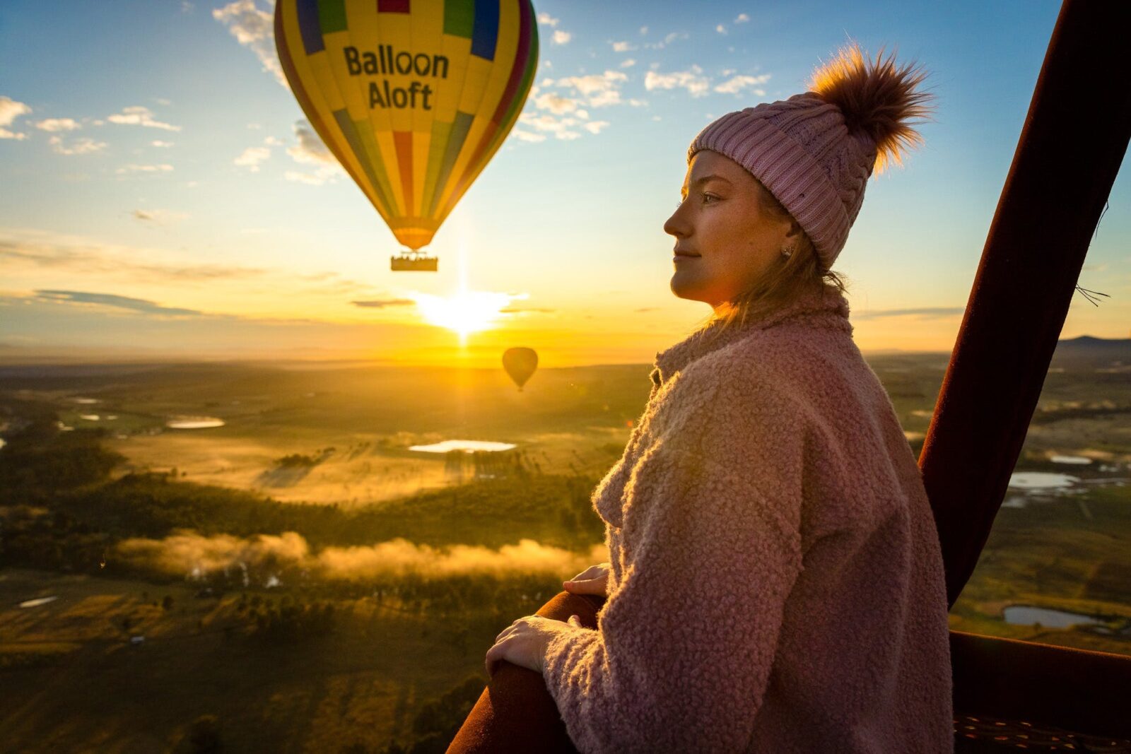 hot air balloon with a person standing in front