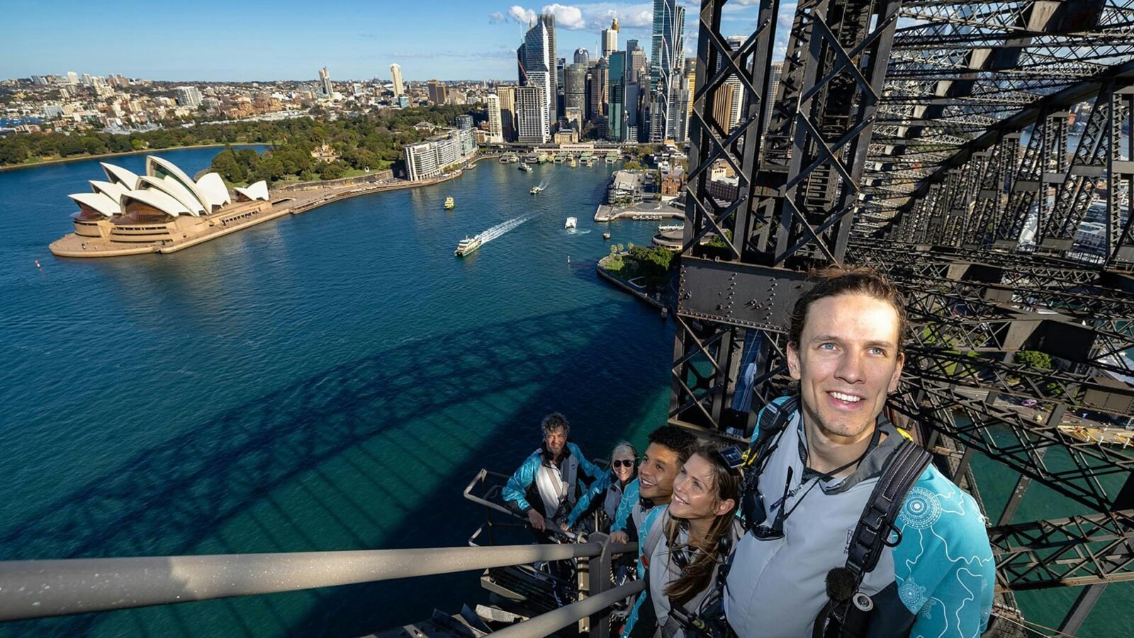 A group of Climbers on the Sydney Harbour Bridge with Sydney Harbour in the background