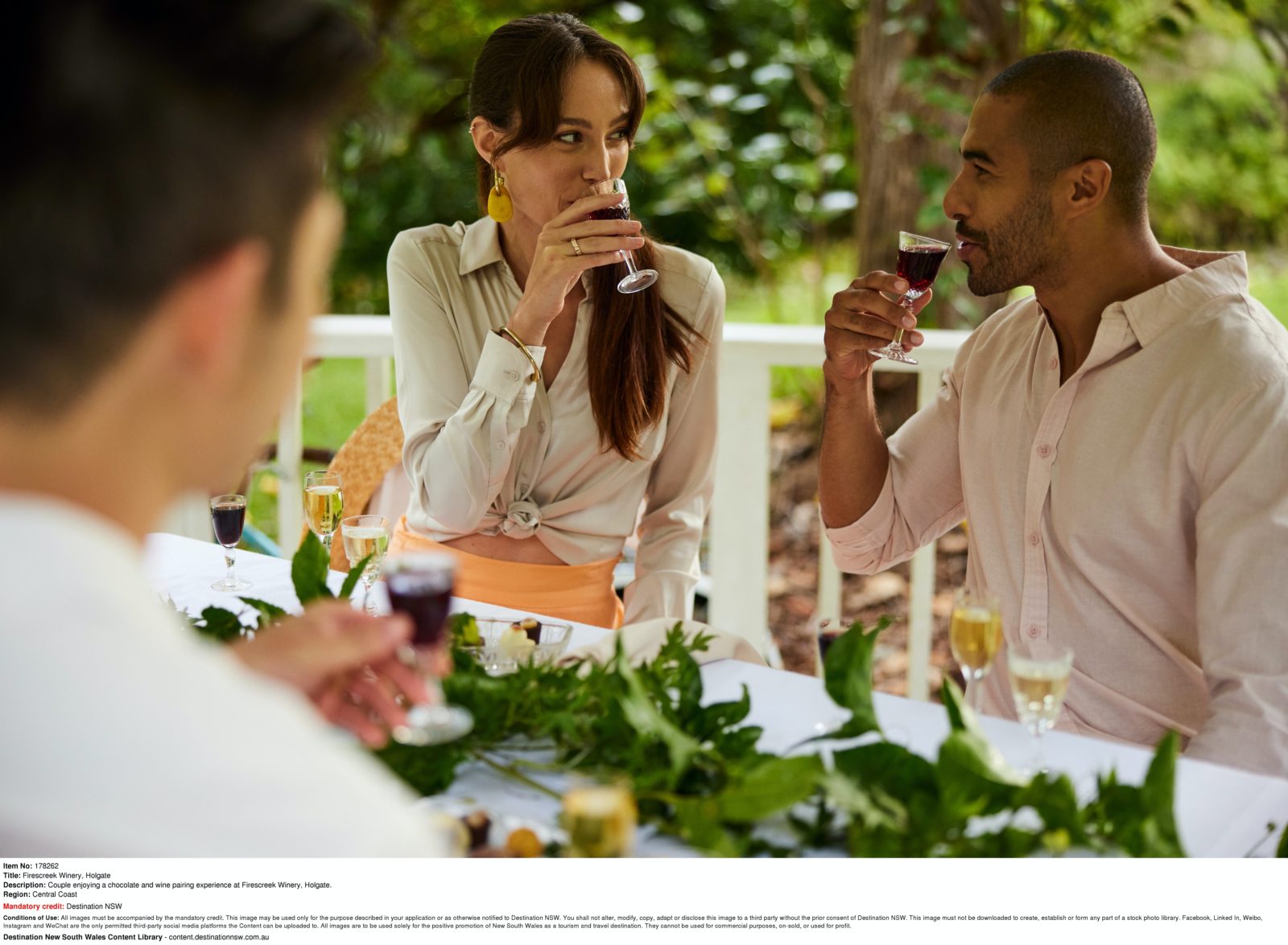 Couple enjoying chocolate and wine pairing