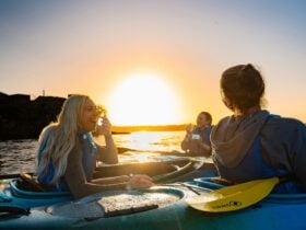 Sunset moment with 3 people enjoying the surroundings while Kayaking