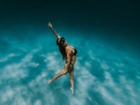 Female swimming to surface of ocean