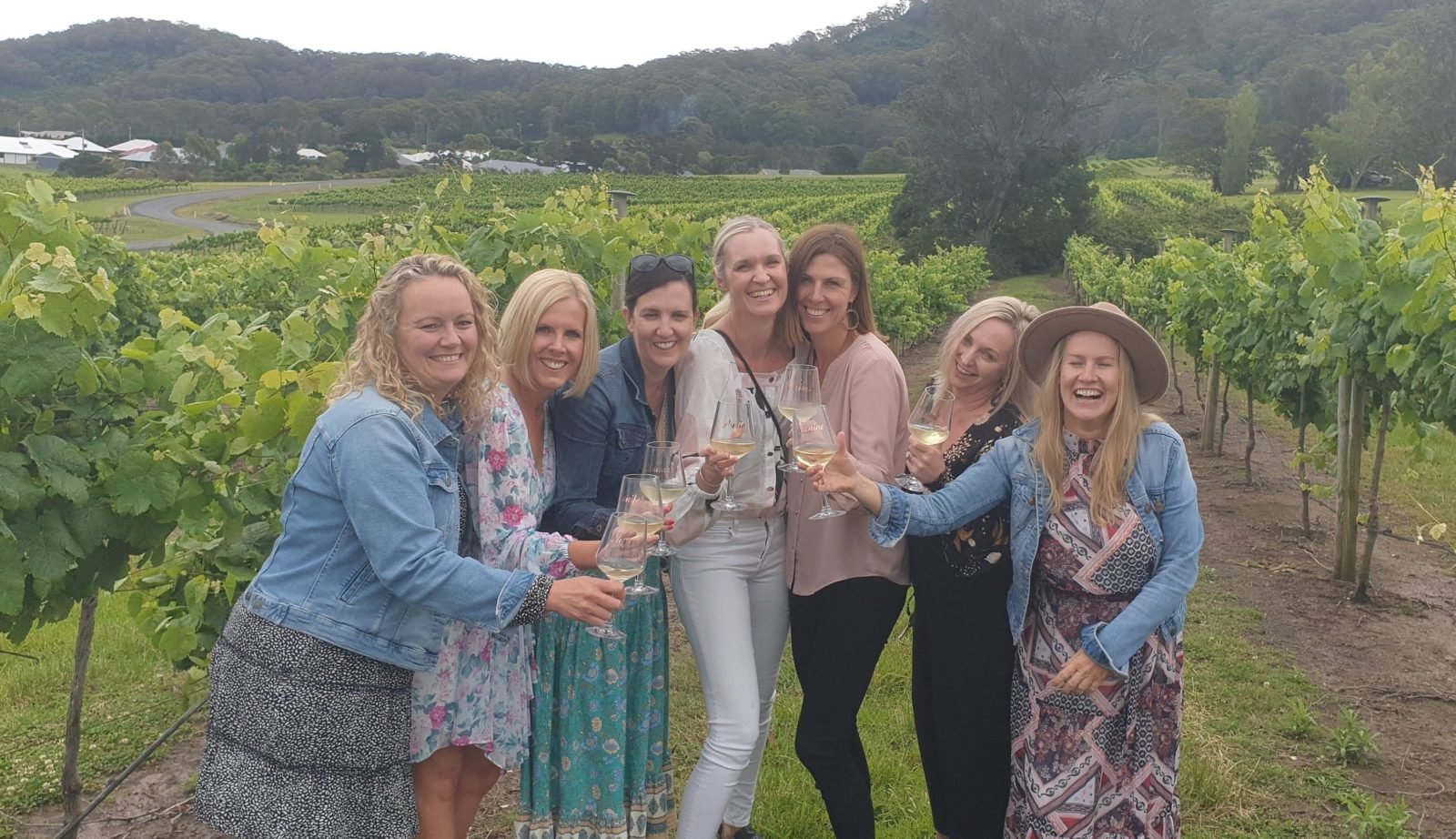 group laughing in vineyards