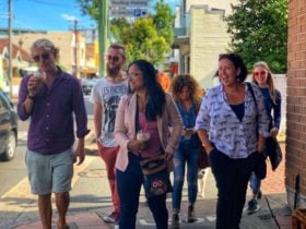 ID tour group walking through the streets of Marrickville and laughing at the guide