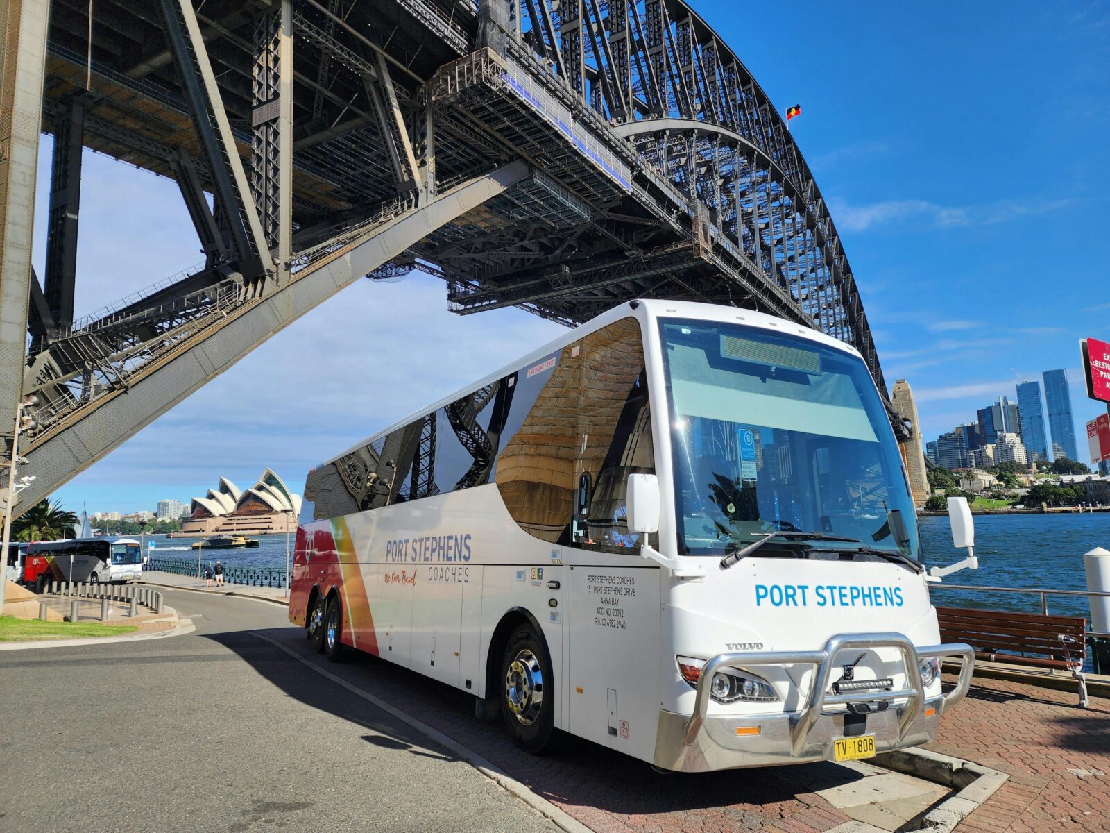 Port Stephens Coaches Sitting under Sydney Harbour Bridge