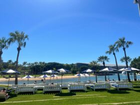 Blue and white daybeds and umbrellas overlooking the lagoon